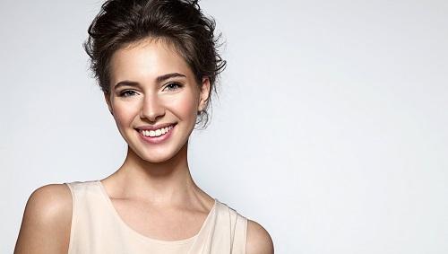 Dental patient smiling after teeth whitening in Aston PA