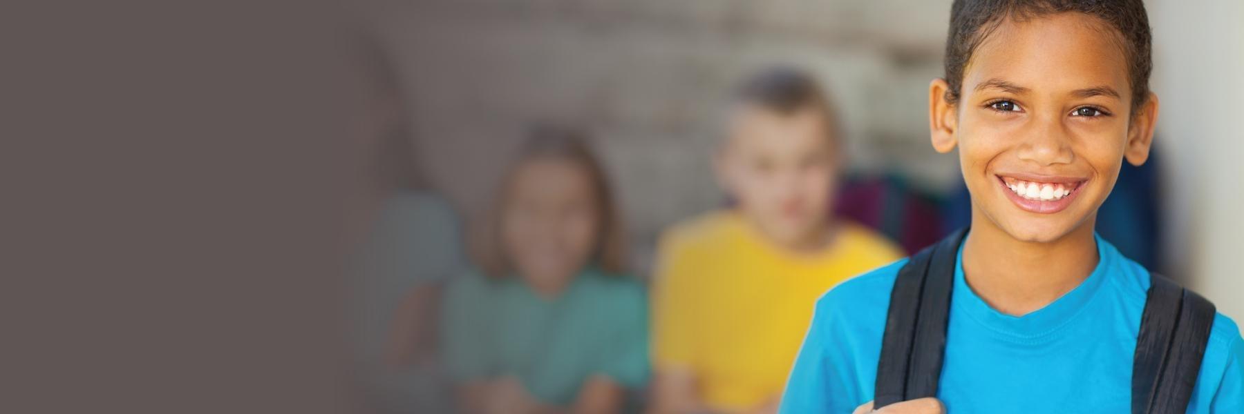 Student smiling at school - healthy snacks for oral health 