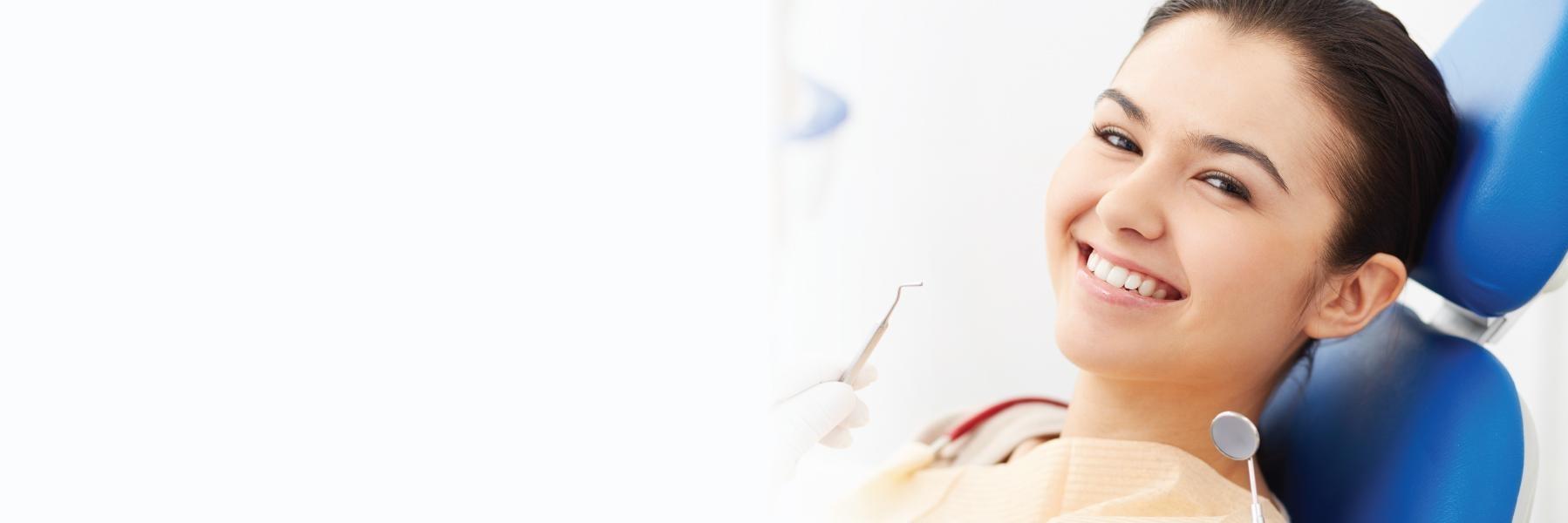 Woman in treatment chair for root canal in Apex NC