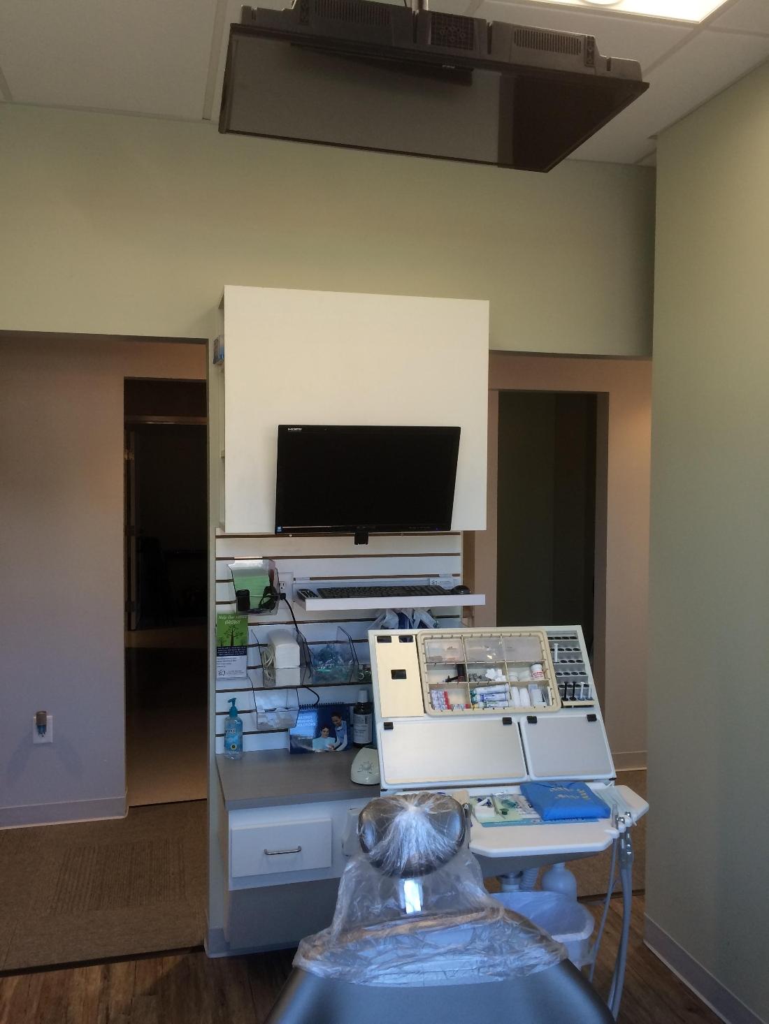 Modern dental technology in patient treatment room at our Apex NC dentist office